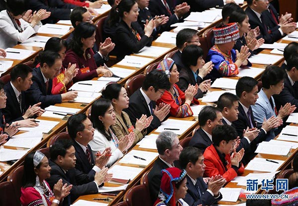 delegates-19th-CPC-national-congress-applaud-opening-report.jpg