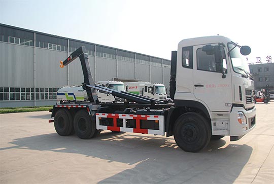 Car unloading garbage truck